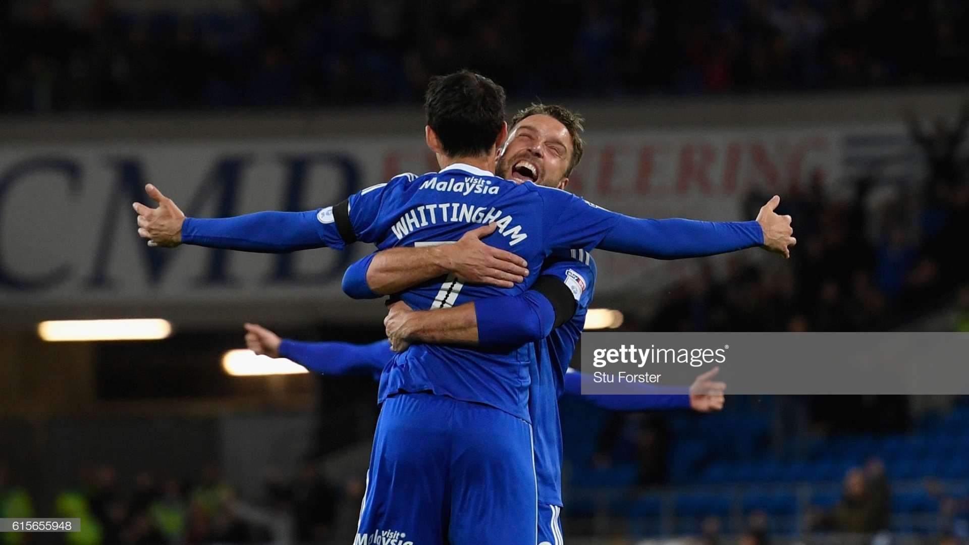 Rickie Lambert embraces Cardiff City legend Peter Whittingham (Photo by Stu Forster/Getty Images)